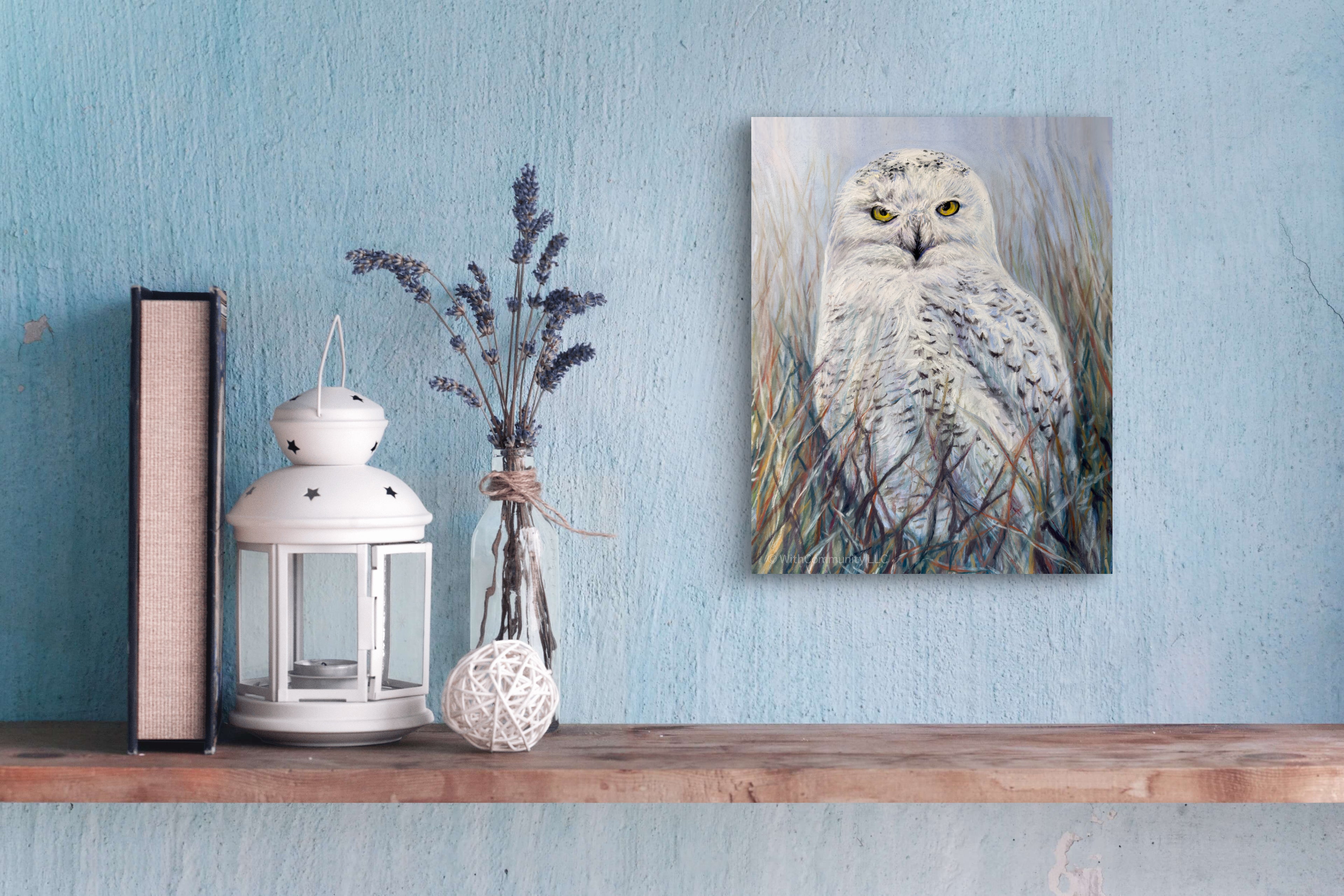 Canvas print of an owl on a wooden shelf with decorative items against a blue wall.
